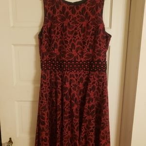 Red lace over black dress